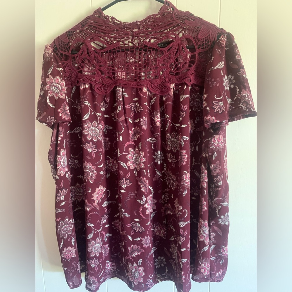Lane Bryant size 18/20 Burgundy Floral blouse with crochet neck area. Never worn